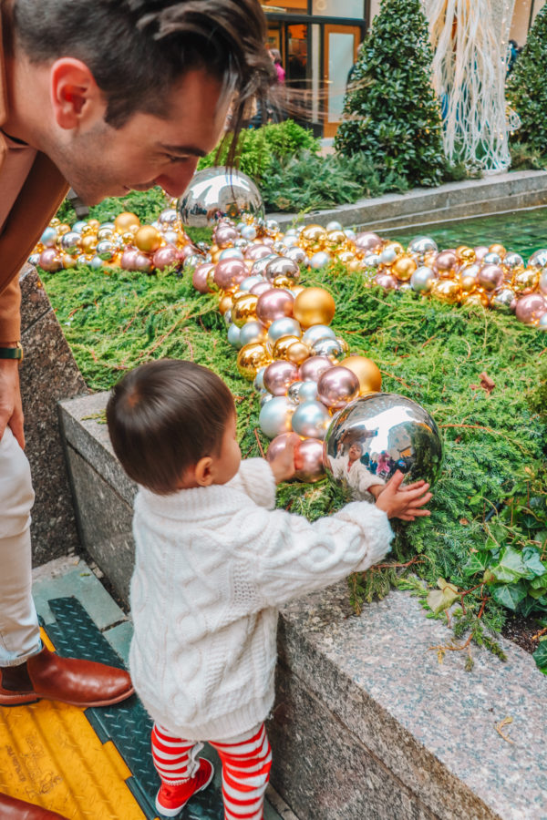 A little boy holding a ball