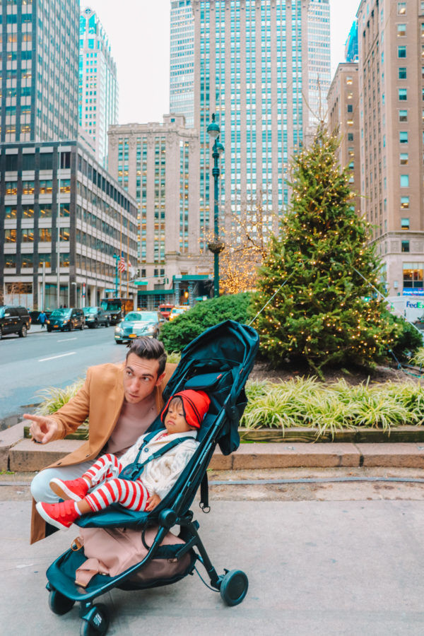 A boy sitting in a stroller 