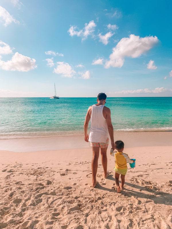 Two people standing on a beach