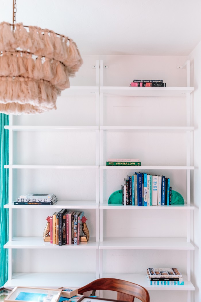 Books on white bookshelves