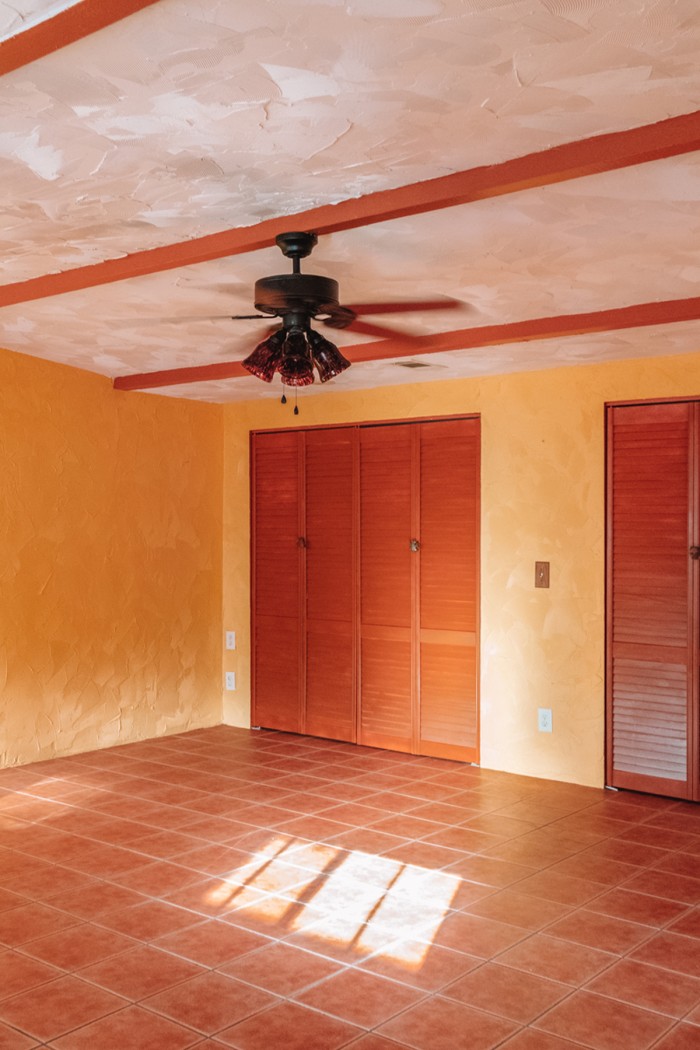 yellow room with wood doors