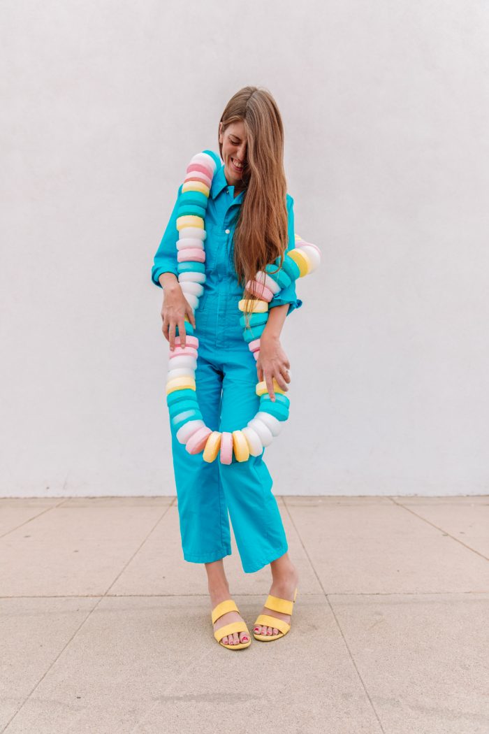 Candy Necklace Costume on woman in blue jumpsuit