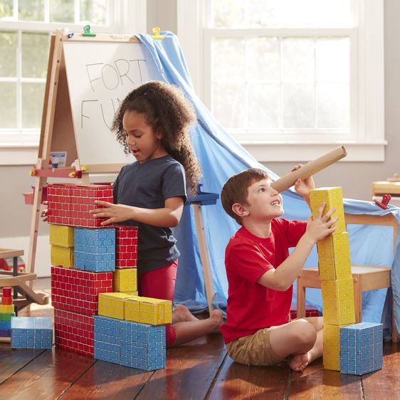 kids playing with cardboard blocks