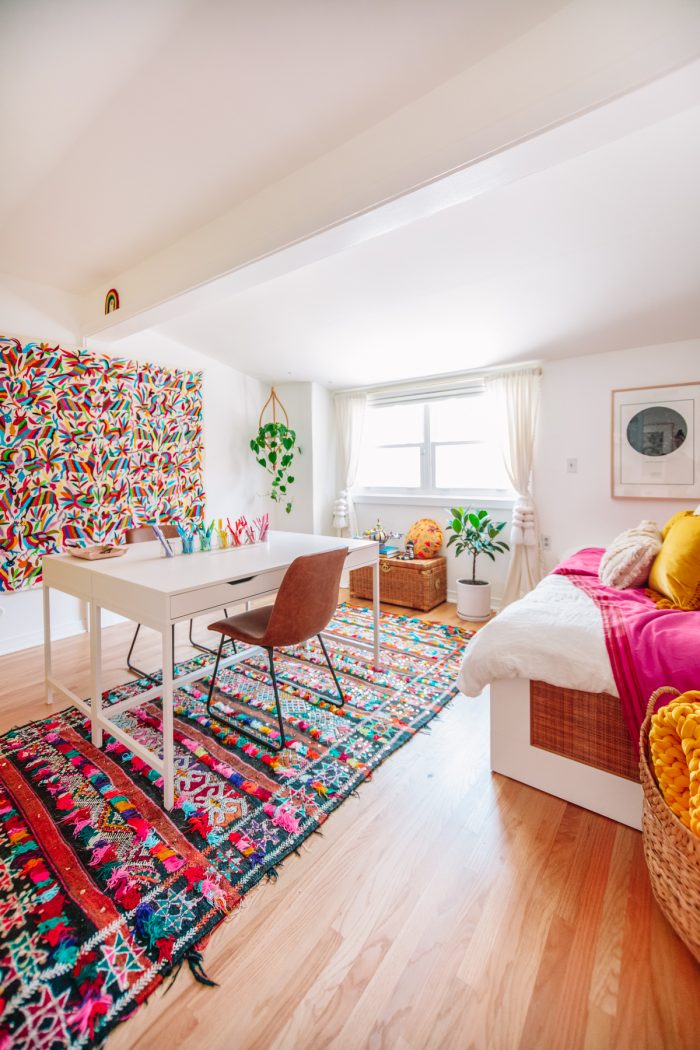 Colorful Home Office Guest Bedroom with Moroccan Rugs and Otomi Tapestry