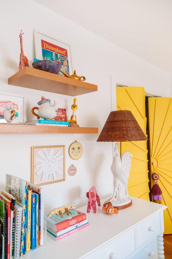 Floating shelves and extra storage in a home office guest room