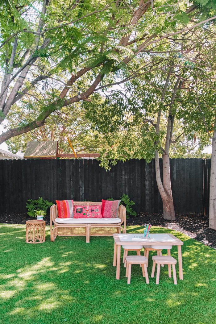 Colorful California Backyard with a Black Fence
