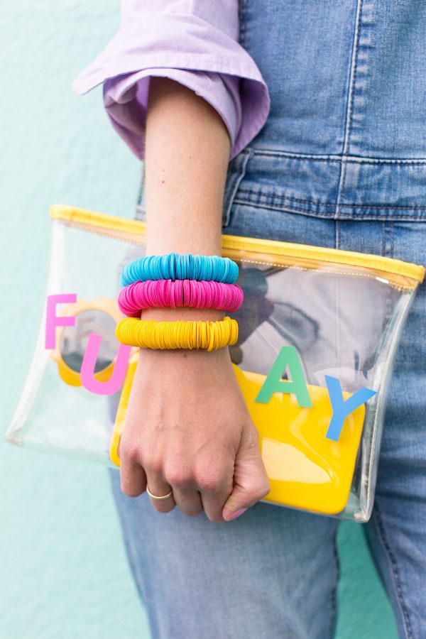 Someone wearing colorful bracelets