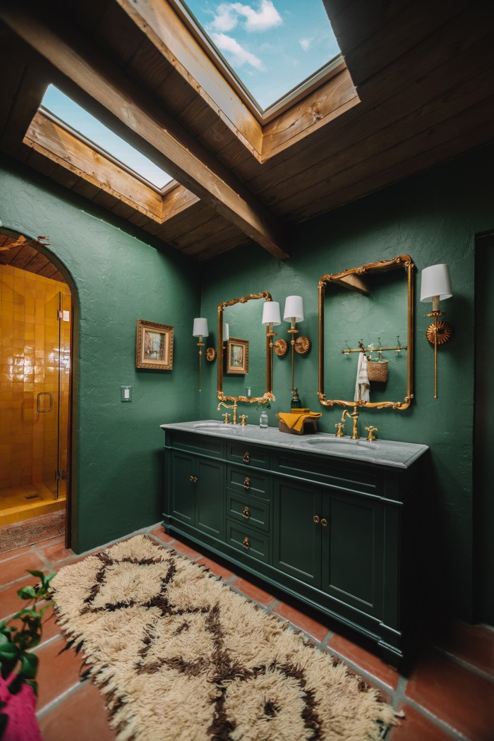 dark green bathroom with skylights