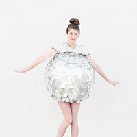 A woman dressed as a disco ball