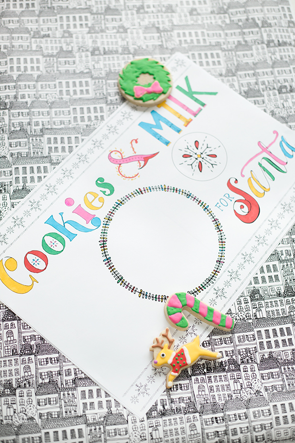 A place mat that says \"cookies and milk\" with bowls on it