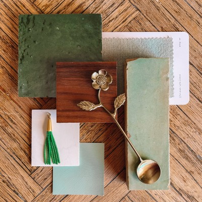 Green bathroom swatches on wood table