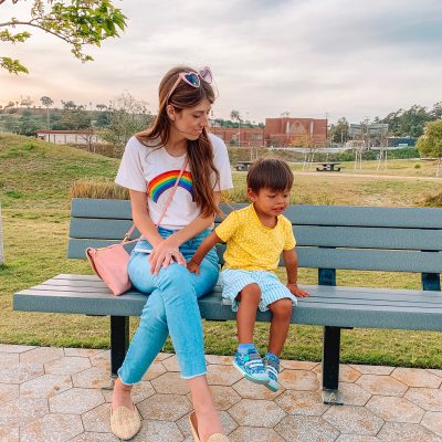 Two people sitting on a park bench