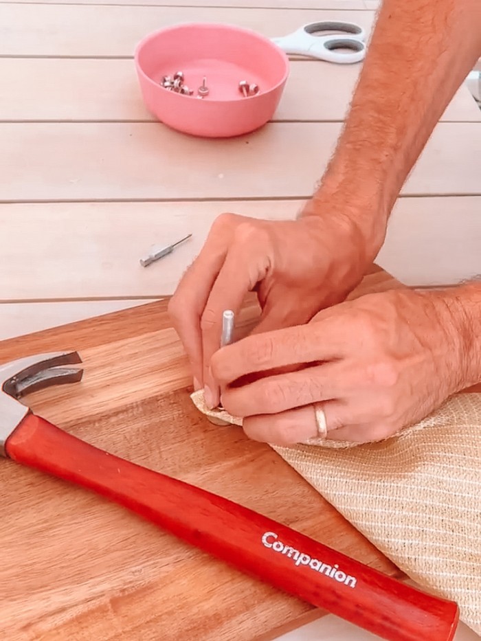 Adding snap with kit to sun shade with hammer in the front