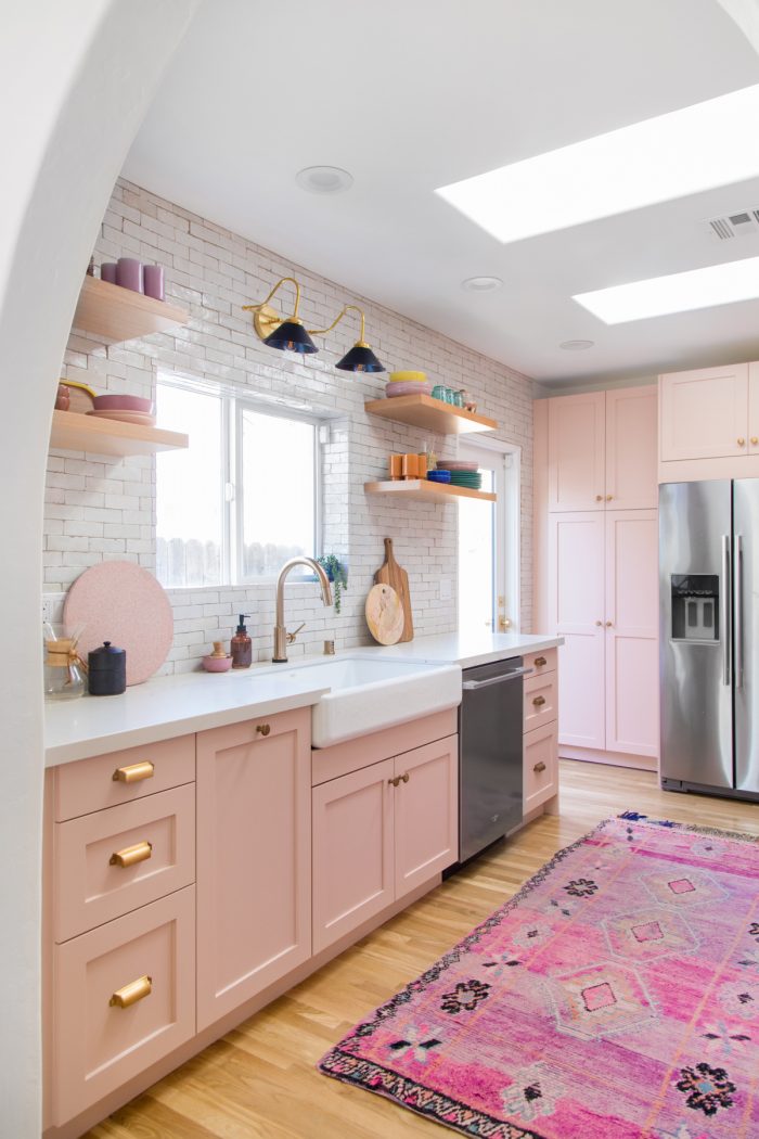 A kitchen with a sink and a window