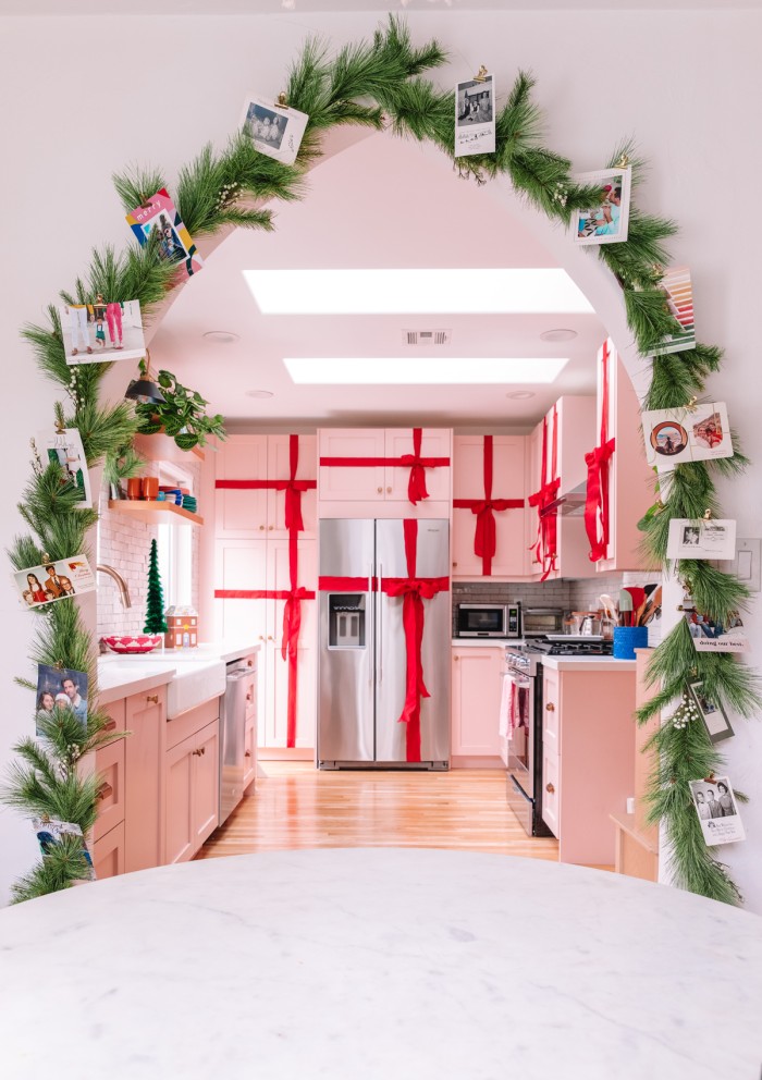 Christmas cards on garland around arch