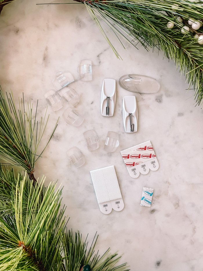 command hooks on marble table with garland