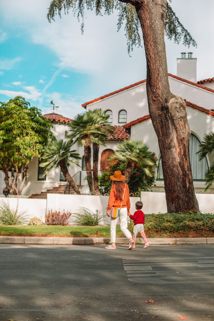 A woman and her son in front of a Spanish house