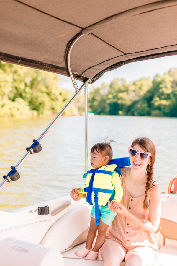 A little boy and a woman on a boat