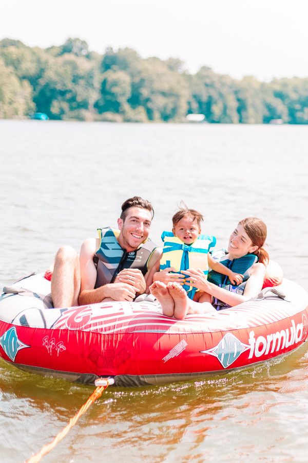 A group of people sitting on a raft