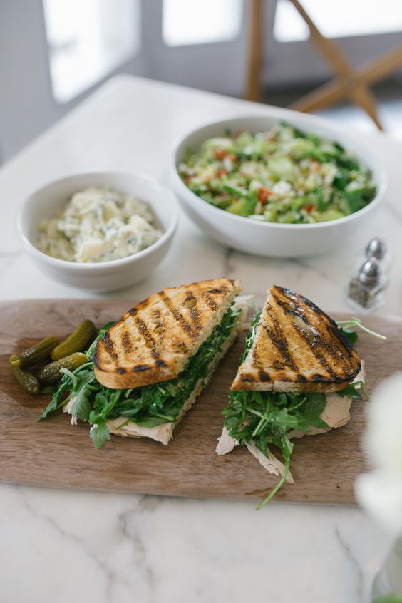 Lemon turkey sandwich on a marble table