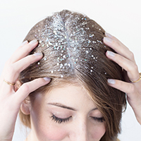 A woman with white material in her hair