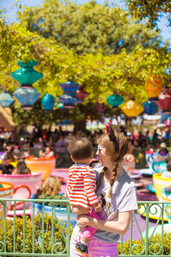 Two people standing in front of a ride