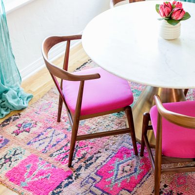 Dining room with pink chairs