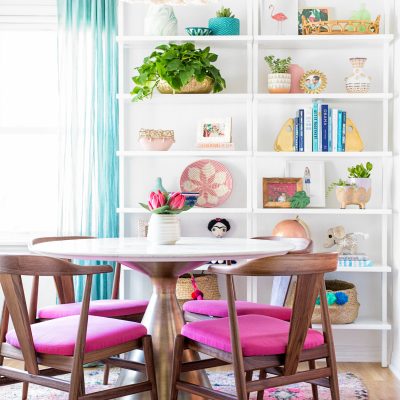 A dining room filled with shelves