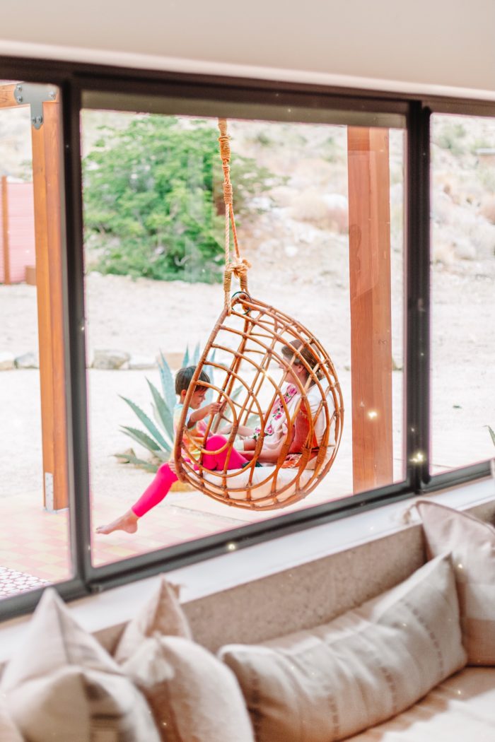 Hanging rattan chair at Oeste in Yucca Valley