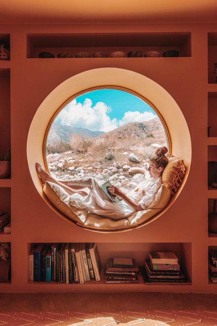 Circle window looking out on Yucca Valley desert