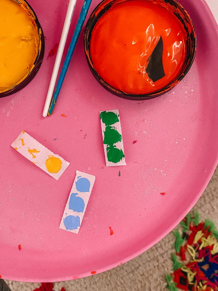 A close up of a plate on a table with paint