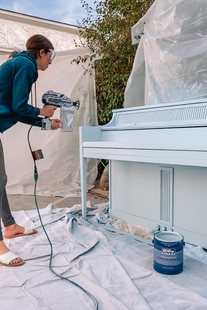 Painting a piano with a paint sprayer