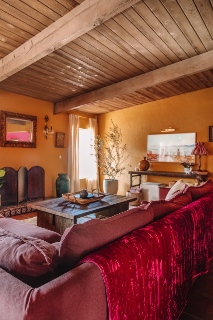 ochre living room with purple couch