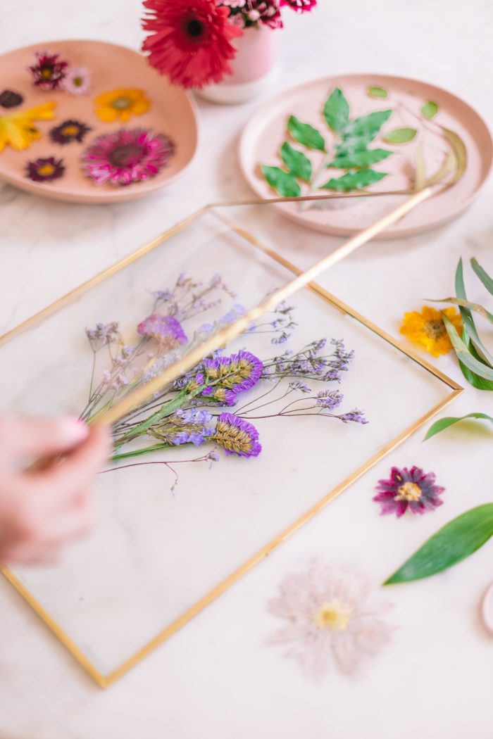 Pressed purple botanical bouquet in frame