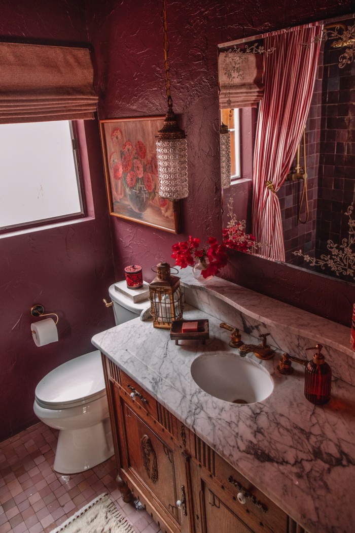 wood and marble vanity in purple bathroom