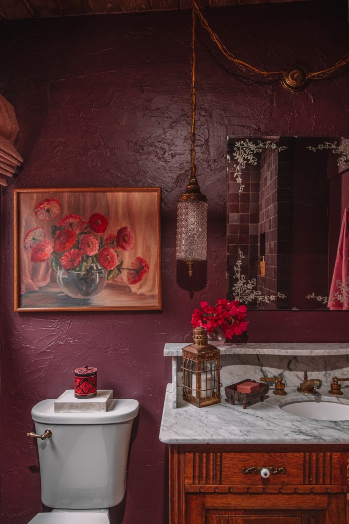 purple bathroom with floral painting