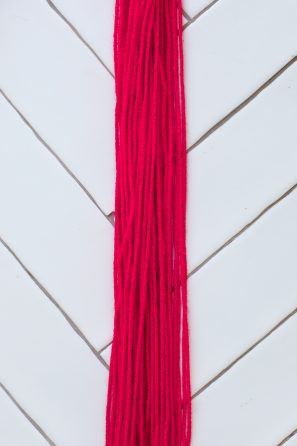 A close up of pink yarn