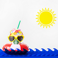 A starbucks drink with summer decor