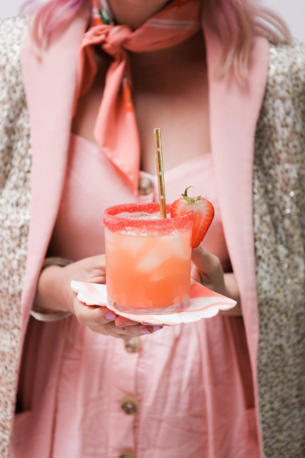 Someone holding a pink drink