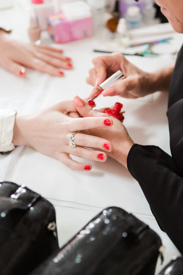 Someone getting their nails painted