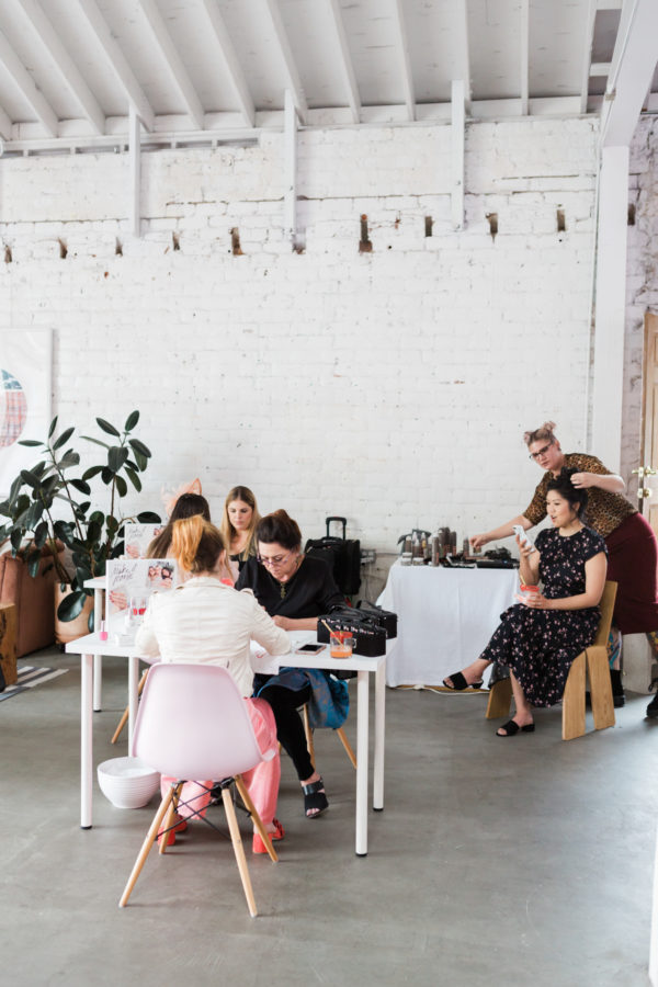 A group of people in a room at tables