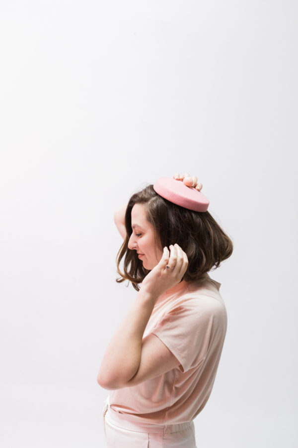 A woman wearing a pink hat