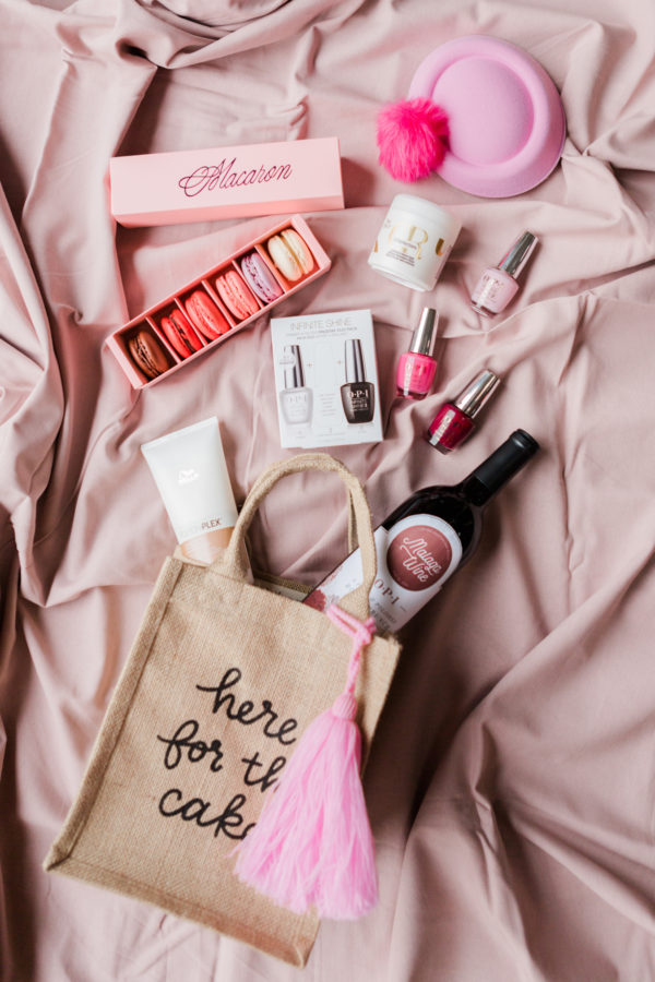 A bag with wine, nail polish, and macaroons