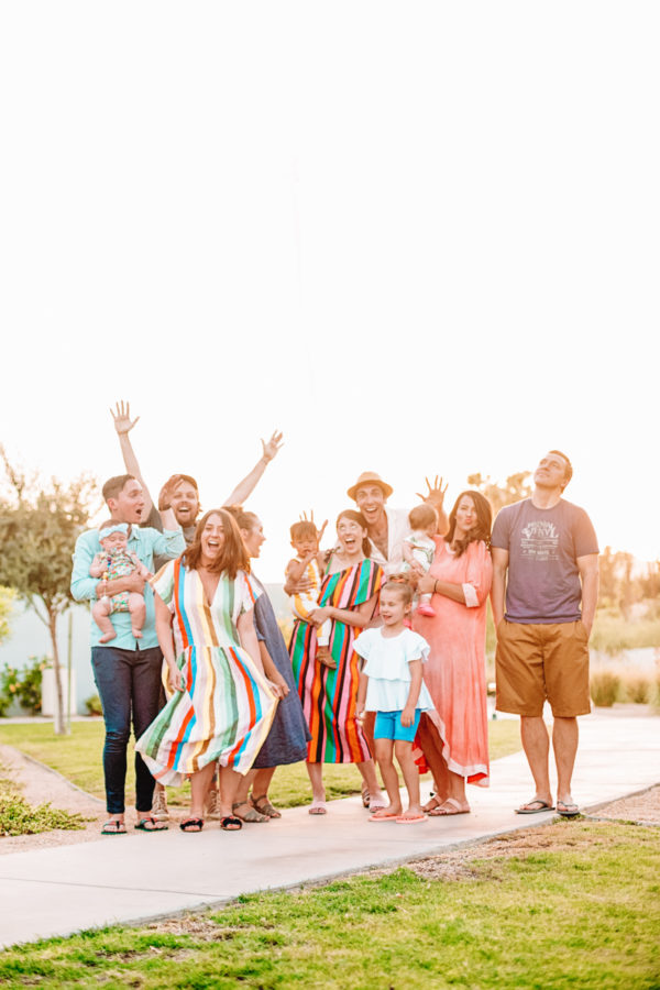 A group of people standing in the grass