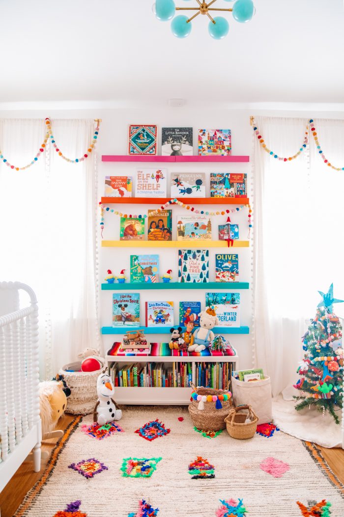 A bedroom with rainbow shelves