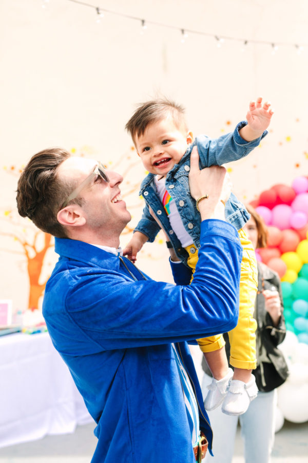 A man holding a little boy