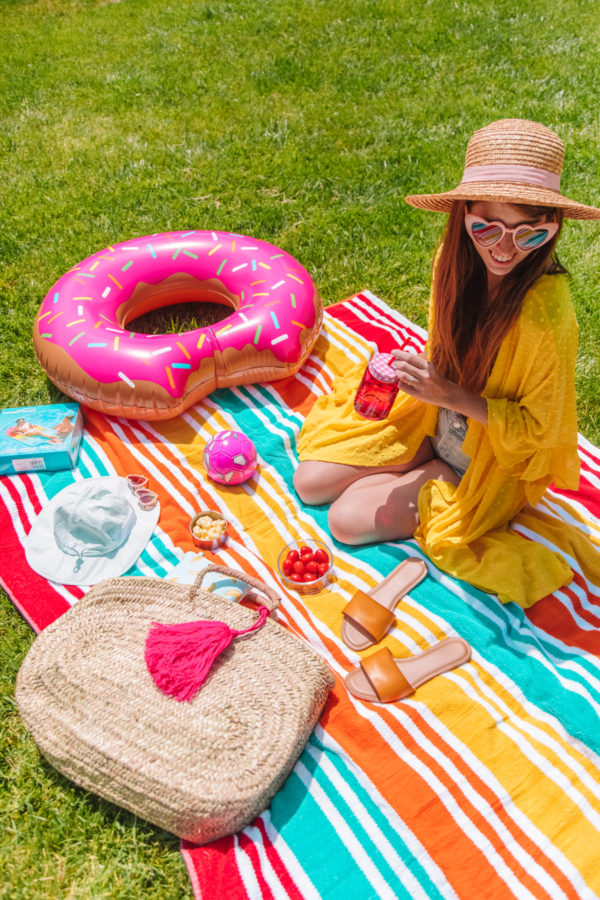 A person wearing a colorful blanket