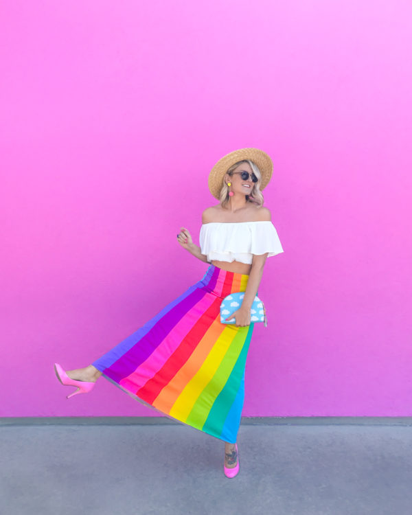 A woman in a rainbow skirt