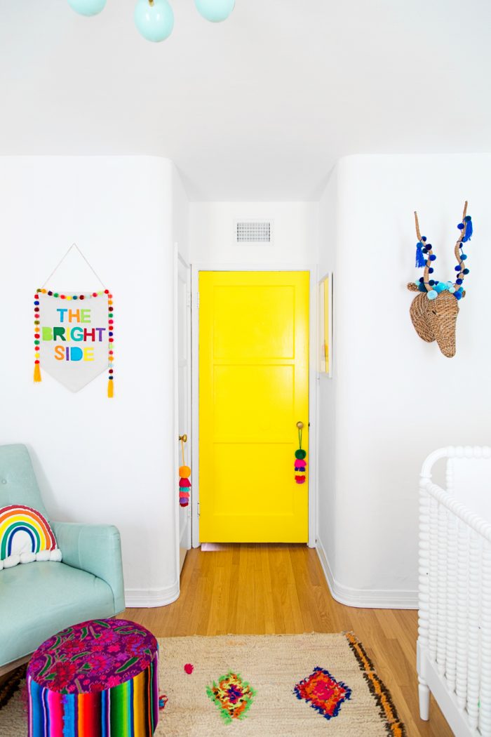 A bedroom with a yellow door