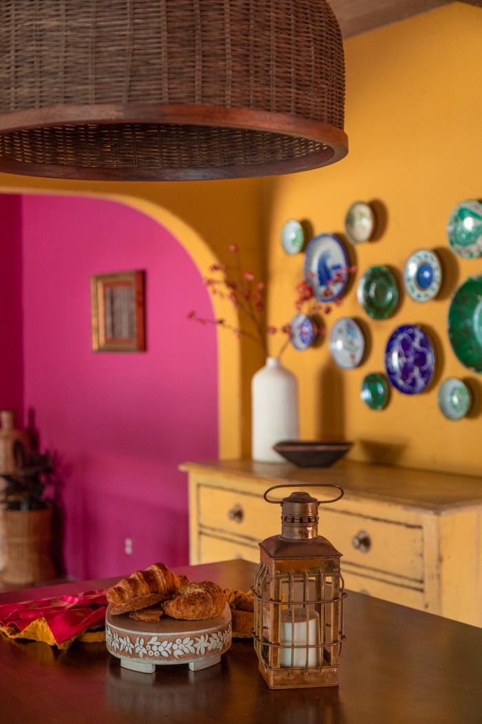 decorative plate wall in yellow kitchen